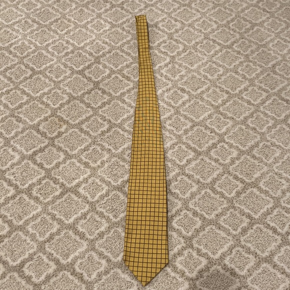 It is a Harold Powell tie originally prices $35. Gold & black checkered pattern. - Picture 3 of 5